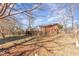 Large backyard featuring a deck and mature trees at 114 Evelyn Dr, Knightdale, NC 27545