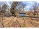 Wide backyard with storage buildings and mature trees creates a beautiful, natural landscape at 114 Evelyn Dr, Knightdale, NC 27545