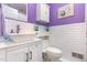 Modern bathroom featuring a white vanity, vessel sink, subway tile, and purple walls at 114 Evelyn Dr, Knightdale, NC 27545