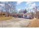 Home exterior with brick, concrete driveway, and manicured front lawn at 114 Evelyn Dr, Knightdale, NC 27545