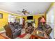 Bright living room with hardwood floors, open archway, and ample seating at 114 Evelyn Dr, Knightdale, NC 27545