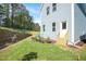 New home backyard shows the graded yard and retaining wall adjacent to the wooded area at 120 Weavers Grove Dr, Chapel Hill, NC 27514