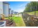 View of a new construction backyard of a new home, featuring a retaining wall at 120 Weavers Grove Dr, Chapel Hill, NC 27514