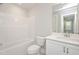 Bright bathroom featuring vanity, soaking tub, and toilet at 120 Weavers Grove Dr, Chapel Hill, NC 27514