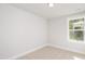 Bright bedroom featuring carpet flooring, neutral walls, and large window at 120 Weavers Grove Dr, Chapel Hill, NC 27514