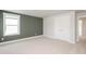Bright bedroom featuring neutral carpet, a large window, and closet with double doors at 120 Weavers Grove Dr, Chapel Hill, NC 27514