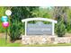 Welcoming Weaversgrove community sign with stone base and lush greenery at 120 Weavers Grove Dr, Chapel Hill, NC 27514