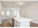 Open concept kitchen features large island, pendant lighting, and stainless appliances at 120 Weavers Grove Dr, Chapel Hill, NC 27514