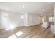 Open concept living room featuring luxury vinyl flooring and natural light at 120 Weavers Grove Dr, Chapel Hill, NC 27514
