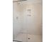 Bathroom featuring tile shower with glass doors and built-in niche at 120 Weavers Grove Dr, Chapel Hill, NC 27514