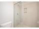 Bathroom featuring tile shower with glass doors and built-in niche at 120 Weavers Grove Dr, Chapel Hill, NC 27514