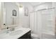 Bathroom features a tub and shower combination, and a black vanity with a white countertop at 140 Big Barn Dr, Wendell, NC 27591