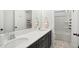 Bathroom featuring double sinks, dark cabinets, white countertop, and bath tub at 140 Big Barn Dr, Wendell, NC 27591