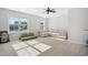Bonus room with large windows, neutral furniture and ceiling fan at 140 Big Barn Dr, Wendell, NC 27591