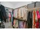 Walk-in closet with ample hanging space and storage shelves at 140 Big Barn Dr, Wendell, NC 27591