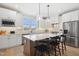 Modern kitchen boasts a large island with bar seating, stainless steel appliances, and ample counter space at 140 Big Barn Dr, Wendell, NC 27591