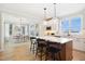 Spacious kitchen island with seating overlooks the dining area, offering a seamless entertaining space at 140 Big Barn Dr, Wendell, NC 27591