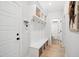 Mudroom with white wainscoting, a bench, hooks, and storage baskets at 140 Big Barn Dr, Wendell, NC 27591