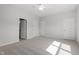 Spacious bedroom with neutral carpet, ceiling fan, and ample closet space for storage at 156 Fideaux Blvd # 248, Raleigh, NC 27603