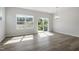 Dining area with large windows and a sliding glass door offering natural light and outdoor views at 156 Fideaux Blvd # 248, Raleigh, NC 27603