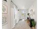 A stylish entryway with decor, natural light from window and an open front door at 156 Fideaux Blvd # 248, Raleigh, NC 27603