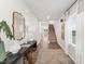 A foyer with console table, decor, a decorative rug and staircase in the background at 156 Fideaux Blvd # 248, Raleigh, NC 27603