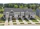 Aerial view of modern townhomes showcases well-manicured lawns and coordinated color schemes at 156 Fideaux Blvd # 248, Raleigh, NC 27603
