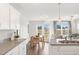 Bright open-concept kitchen with an island sink with adjoining dining and living spaces at 156 Fideaux Blvd # 248, Raleigh, NC 27603