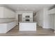 Spacious kitchen showcases an island, white cabinets, granite countertops, and stainless steel appliances at 156 Fideaux Blvd # 248, Raleigh, NC 27603