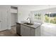 Kitchen island with stainless steel sink and dishwasher, complemented by bright natural light at 156 Fideaux Blvd # 248, Raleigh, NC 27603