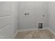A spacious laundry room featuring connections for washer and dryer and wire shelving at 156 Fideaux Blvd # 248, Raleigh, NC 27603