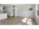 Bright living room featuring hardwood floors and large windows showcasing scenic outdoor views at 156 Fideaux Blvd # 248, Raleigh, NC 27603