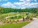 Community playground featuring picnic tables, ample green space, walking path, and modern play equipment at 156 Fideaux Blvd # 248, Raleigh, NC 27603