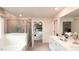 Bright bathroom featuring double sinks, a glass shower, and tile flooring at 2019 Cherry Creek Rd, Haw River, NC 27258