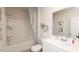 Clean bathroom featuring a shower-tub combo, toilet, and modern sink with stylish decor at 2019 Cherry Creek Rd, Haw River, NC 27258