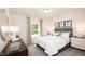 Serene bedroom featuring a comfortable bed, ample natural light, and tasteful decor at 2019 Cherry Creek Rd, Haw River, NC 27258