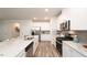 Bright kitchen with stainless steel appliances, granite countertops, and modern white cabinetry at 2019 Cherry Creek Rd, Haw River, NC 27258
