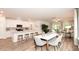 Open-concept living area with kitchen island, modern dining area, and comfortable living room setup at 2019 Cherry Creek Rd, Haw River, NC 27258