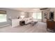 Cozy upstairs loft area with comfortable seating and plenty of natural light at 2019 Cherry Creek Rd, Haw River, NC 27258