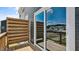 Charming balcony with wooden floors and privacy screen and large sliding glass doors at 2241 Horton Park Dr, Apex, NC 27539