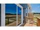 Relaxing balcony featuring wooden floors and railings offering expansive neighborhood views at 2241 Horton Park Dr, Apex, NC 27539