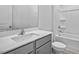 Bright bathroom featuring a tub with shower and a vanity with countertop and modern faucet at 2241 Horton Park Dr, Apex, NC 27539