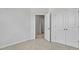 Bedroom with carpet flooring featuring a closet with double doors at 2241 Horton Park Dr, Apex, NC 27539