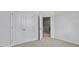 Bedroom with carpet flooring featuring a closet with double doors at 2241 Horton Park Dr, Apex, NC 27539