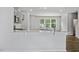 Elegant kitchen featuring stainless appliances, an island and a breakfast bar with white countertop at 2241 Horton Park Dr, Apex, NC 27539