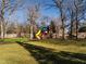 Backyard with a playground, swing set and a lush lawn at 2511 Pineway Dr, Burlington, NC 27215