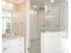 Sleek bathroom featuring a glass-enclosed shower, marble countertops, and modern fixtures at 2511 Pineway Dr, Burlington, NC 27215