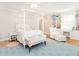 Bedroom featuring a four poster bed, white furniture, hardwood flooring and built-in shelving at 2511 Pineway Dr, Burlington, NC 27215
