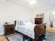 Bedroom featuring a wooden sleigh bed with bright, natural light and hardwood flooring at 2511 Pineway Dr, Burlington, NC 27215