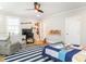 Bedroom featuring hardwood flooring, ceiling fan and decorative artwork at 2511 Pineway Dr, Burlington, NC 27215